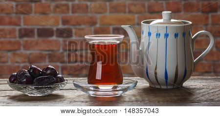Tea with dates. Tea time. Selective focus