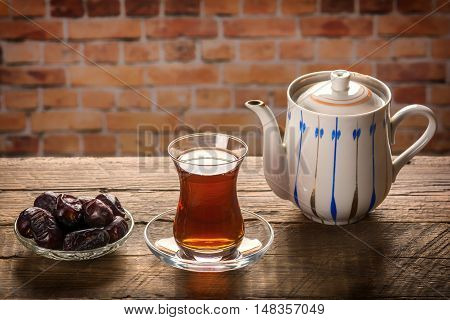 Tea with dates. Tea time. Selective focus