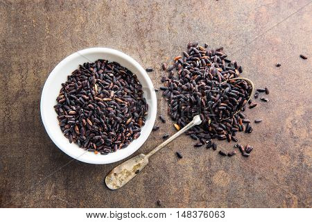 The nerone rice in bowl on kitchen table. Top view.