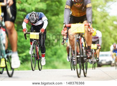 group of cyclist at professional race on the road