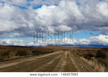 Brown Road  And Cloudy Sky In Prince Albert