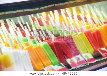 Many boxes of ice cream gelato in a shop