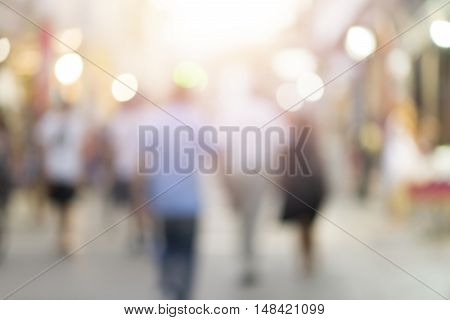 blur abstract people background unrecognizable silhouettes of people walking on a street