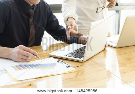 Business people discussing and analyze data chart. Teamwork brainstroming about the successful business