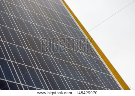 Close-up detail of a thin film photovoltaic solar panel. Energy and concervation technology concept.