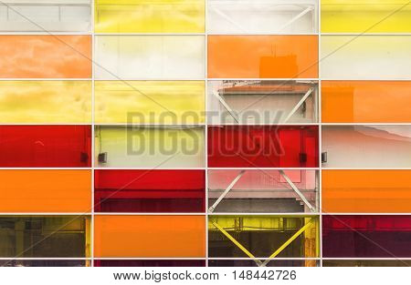 The storefront, colored rectangular glass with reflections