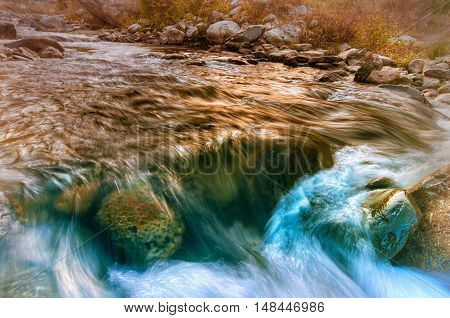 Beautiful Reshi River water flowing through stones and rocks at dawn Sikkim India. Reshi is one of the most famous rivers of Sikkim flowing through the state and serving water to many local people.