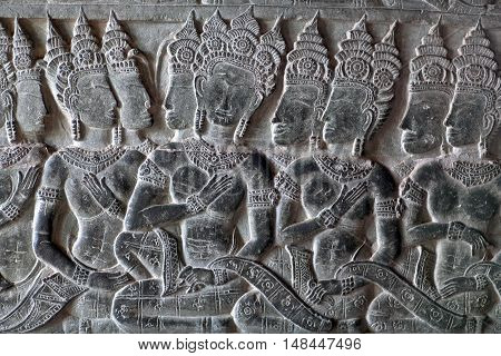 Ancient bas-relief at the facade of Angkor Wat in Angkor, Cambodia. Angkor Wat was built between 1113 and 1150 by King Suryavarman II.