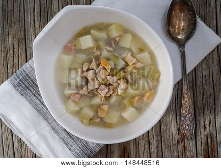 Rhode Island Clam Chowder Soup on Wood Background, top view.