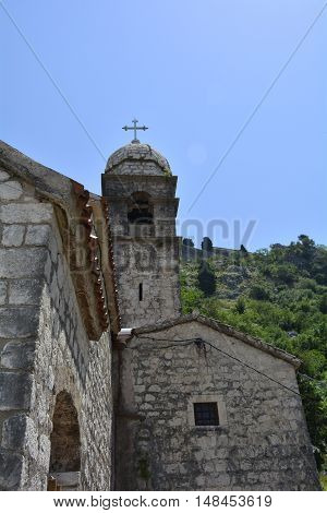 The Our Lady of Remedy church on the hillside above Kotor Montenegro. Built in 1518 the church is part of the popular hiking trail along the town's hillside fotifications