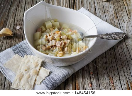 Rhode Island Clam Chowder Soup on Wood Background, selective focus.