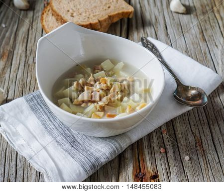 Rhode Island Clam Chowder Soup on Wood Background, selective focus.