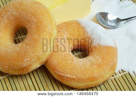 sweet donut with a lot of sugar on bamboo mat
