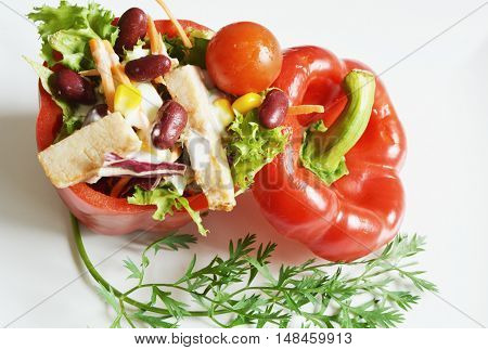 fresh colorful salad in sliced red paprika