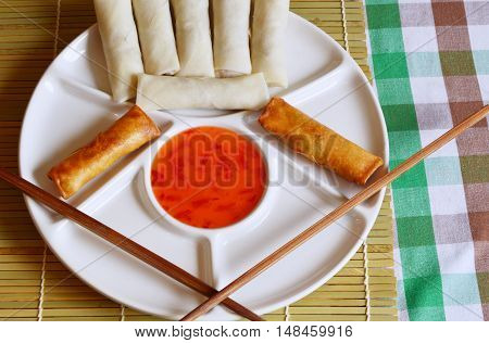 fried spring rolls and chopsticks on plate