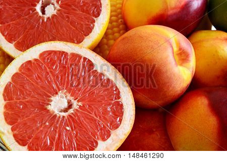 fresh sliced grapefruit with nectarines and corn