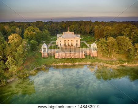 Trakai, Lithuania: Aerial UAV top view of Uzutrakis Palace in the autumn sunset