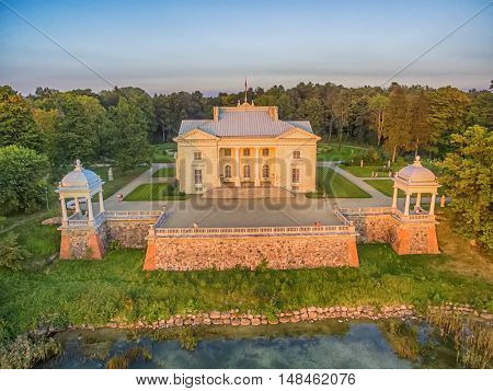 Trakai, Lithuania: Aerial UAV top view of Uzutrakis Palace in the autumn sunset