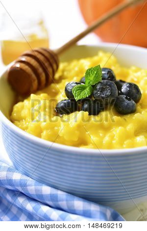 Rice Porridge With Pumpkin And Fresh Blueberry.