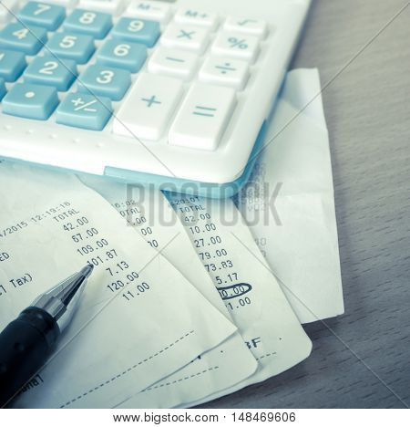 Close up of receipt paper and caculator payment