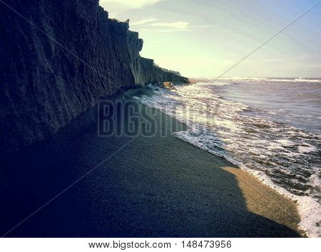 illusion of high rocks on the costline.
