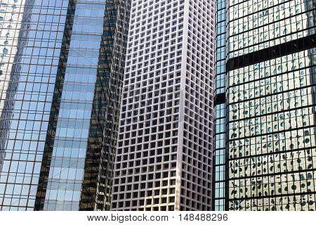 Abstract scene of highrise buildings in Hong Kong CBD. Hong Kong is one of the most densly populated areas in the world the vast majority of people work and live in highrise buildings.