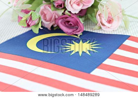 National day : Malaysia flag and flower on tablecloth