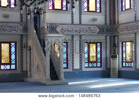 TURKEY ALANYA - NOVEMBER 10 2013: The interior and minbar in a Kuyularonu Mosque in Alanya. The mosque was built in 2005 and has a library for foreign tourists.