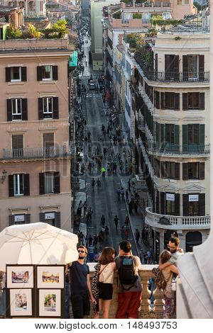 ROME ITALY - JUNE 11 2015: Spanish Steps and Via Condotti in Rome. This street is the center of fashion shopping in Rome with the atelier of Bulgari Armani Cartier Fendi Gucci  and others.