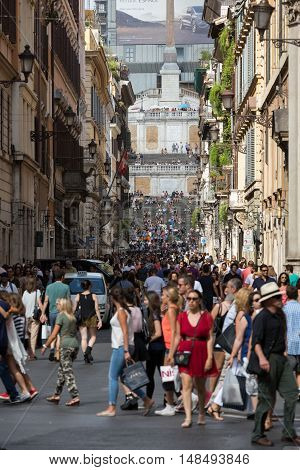 ROME ITALY - JUNE 15 2015: Spanish Steps and Via Condotti in Rome. This street is the center of fashion shopping in Rome with the atelier of Bulgari Armani Cartier Fendi Gucci  and others.