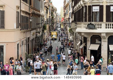 ROME ITALY - JUNE 15 2015: Via Condotti in Rome. This street is the center of fashion shopping in Rome with the atelier of Bulgari Armani Cartier Fendi Gucci and others.