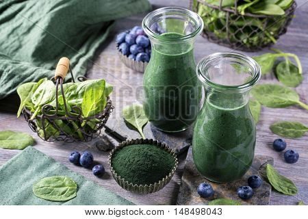 Green smoothie with spirulina,spinach and blueberries