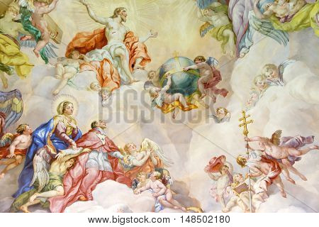 VIENNA AUSTRIA - NOVEMBER 232013: The Karlskirche (St. Charles's Church). Vibrant frescoes of saints and angels decorate the vaulted interior dome of Viennas Karlskirche.