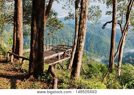Empty wooden balcony on the viewpoint of mountain at Kanchanaburi, Thailand