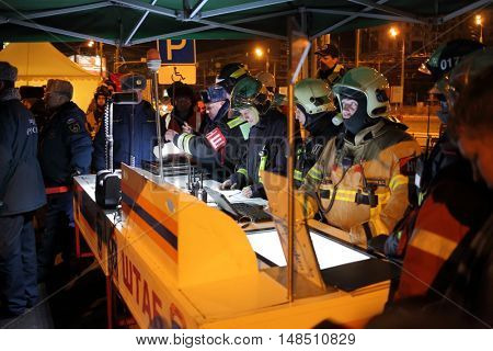 RUSSIA, MOSCOW - FEB 26, 2015: Many firefighters in uniform are standing near headquarter at Preobrazhenskaya ploshchad subway.