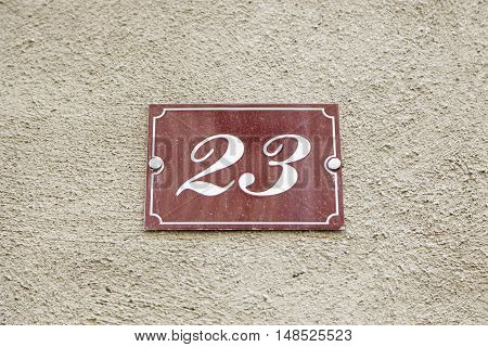 Number Twenty-three On The Wall Of A House