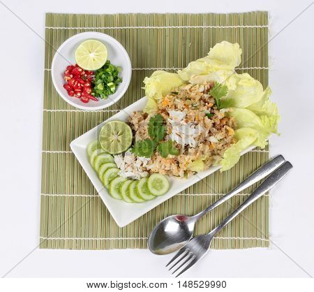 Fried rice with crab topped streamed crab,halve green lemon,sliced cucumber,lettuce and coriander  served  spicy  sour filling side dish.  Top view