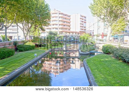 Tet River And The Reflection Of Some Buildings In Perpignan, France
