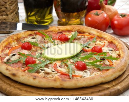 Whole Italian Pizza On Table With Ingredients