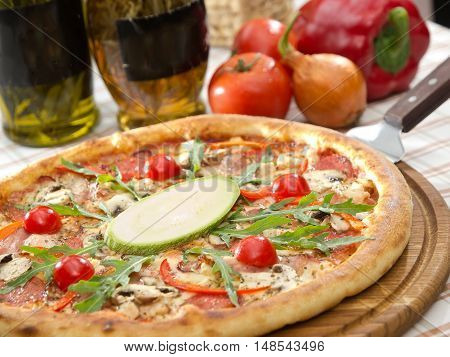 Whole Italian Pizza On Table With Ingredients