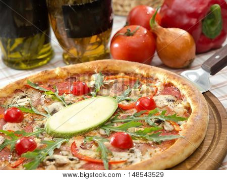 Whole Italian Pizza On Table With Ingredients