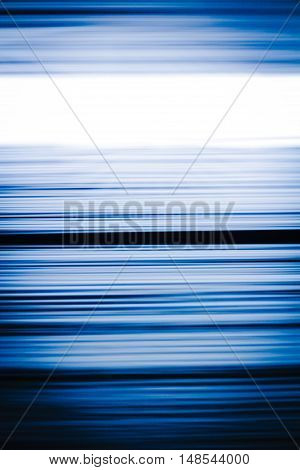 Horizontal motion blur blue and black stripes background in vertical 3:2 format.