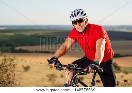 Portrait Of Young Cyclist In Helmet And Glasses