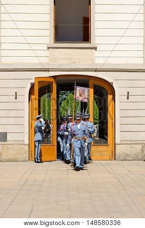 PRAGUE, CZECH REPUBLIC - JULY 4, 2014: Castle guards (Hradni straz) of presidential palace during ceremonial changing of guards. It takes place daily at noon accompanied by a brass band.