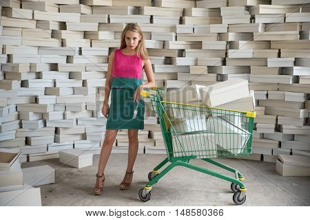 Model posing with trolley from the supermarket