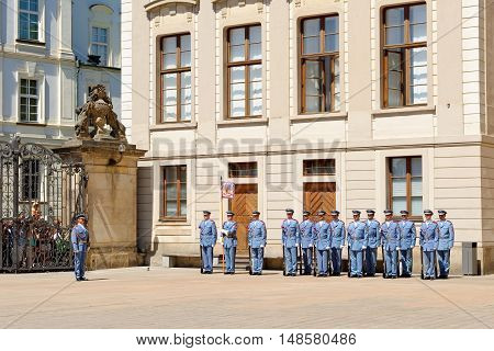 PRAGUE, CZECH REPUBLIC - JULY 4, 2014: Castle guards (Hradni straz) of presidential palace during ceremonial changing of guards. It takes place daily at noon accompanied by a brass band.