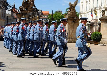 PRAGUE, CZECH REPUBLIC - JULY 4, 2014: Castle guards (Hradni straz) of presidential palace during ceremonial changing of guards. It takes place daily at noon accompanied by a brass band.