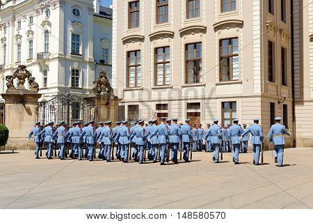PRAGUE CZECH REPUBLIC - JULY 4 2014: Castle guards (Hradni straz) of presidential palace during ceremonial changing of guards. It takes place daily at noon accompanied by a brass band.