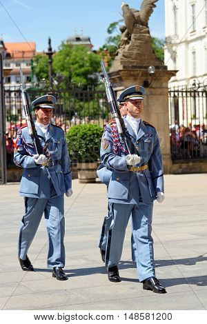 PRAGUE, CZECH REPUBLIC - JULY 4, 2014: Castle guards (Hradni straz) of presidential palace during ceremonial changing of guards. It takes place daily at noon accompanied by a brass band.