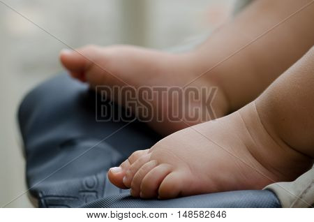 of baby feet, baby first steps. pink leather